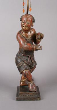 A Red and Brown Lacquered Wood Figure of a Boy, Height of figure 16 inches