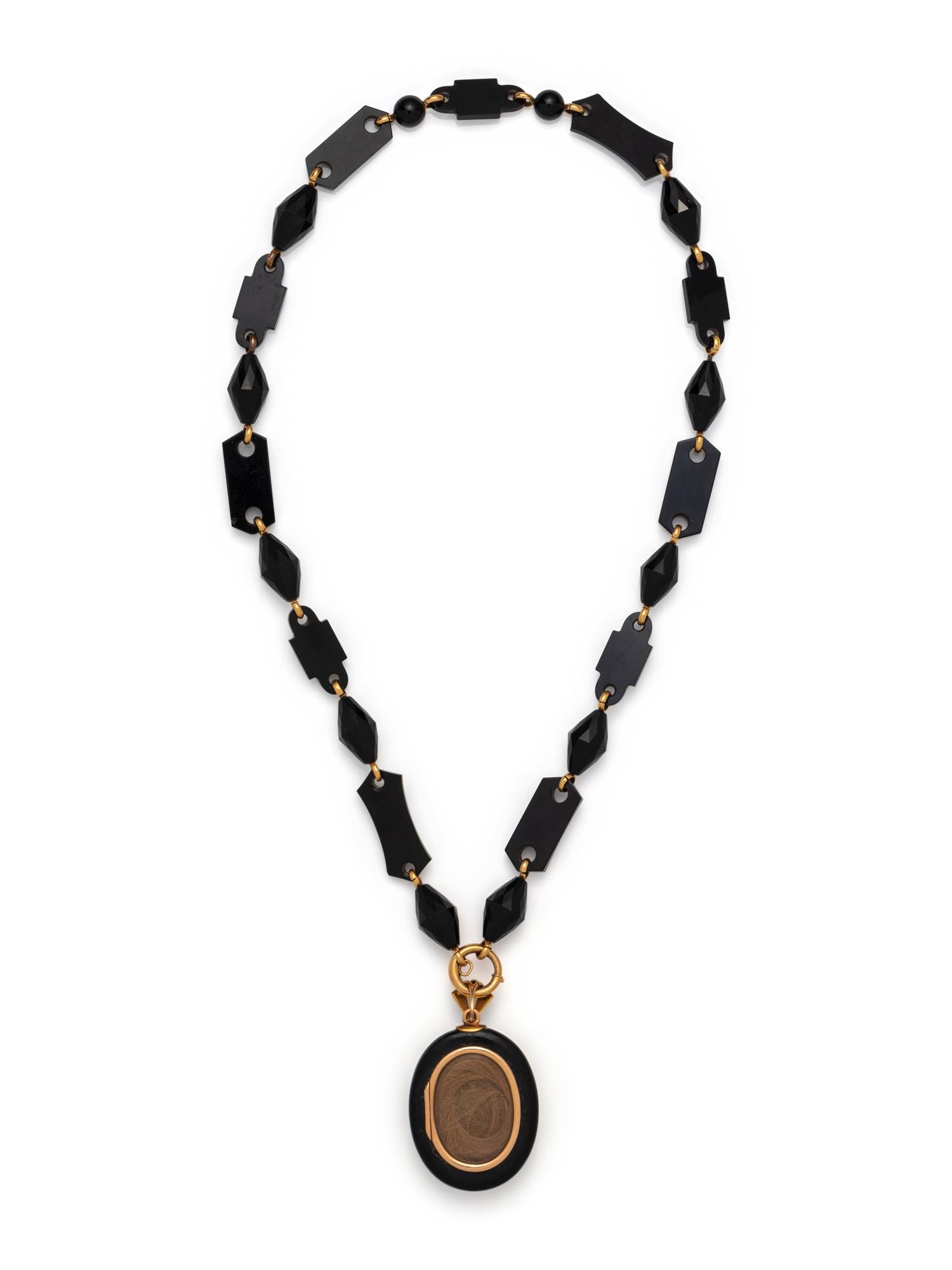VICTORIAN, YELLOW GOLD AND ONYX MOURNING PENDANT/NECKLACE