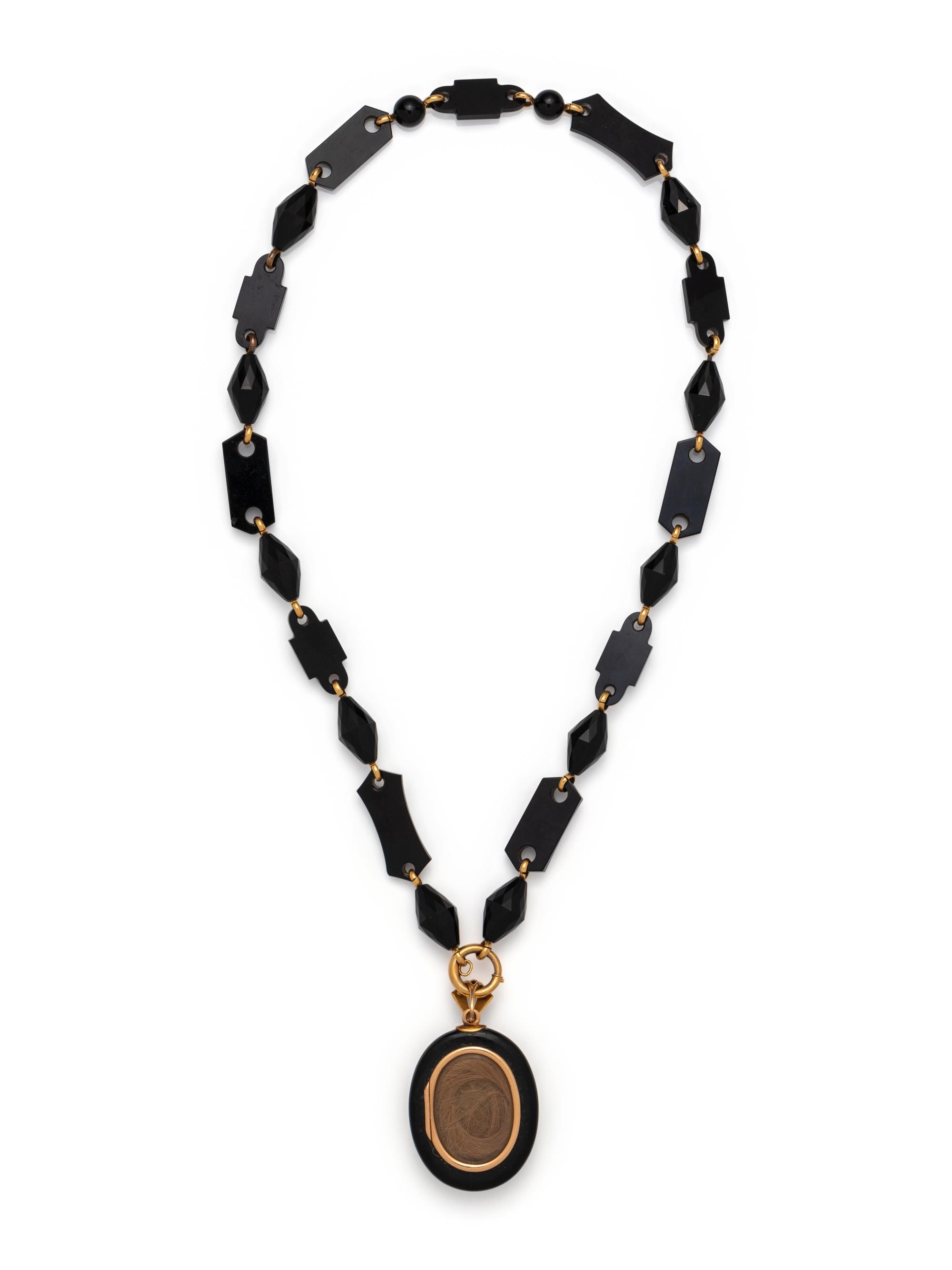 VICTORIAN, YELLOW GOLD AND ONYX MOURNING PENDANT/NECKLACE