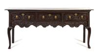 An English Oak Sideboard, Height 33 3/4 x width 78 1/2 x depth 17 3/4 inches.