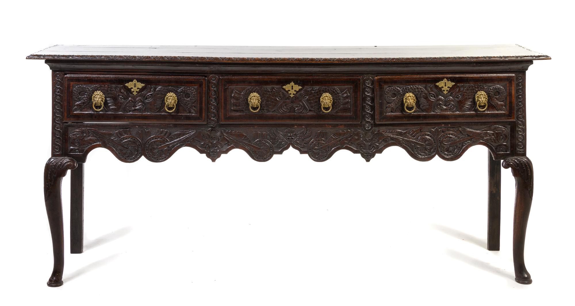 An English Oak Sideboard, Height 33 3/4 x width 78 1/2 x depth 17 3/4 inches.