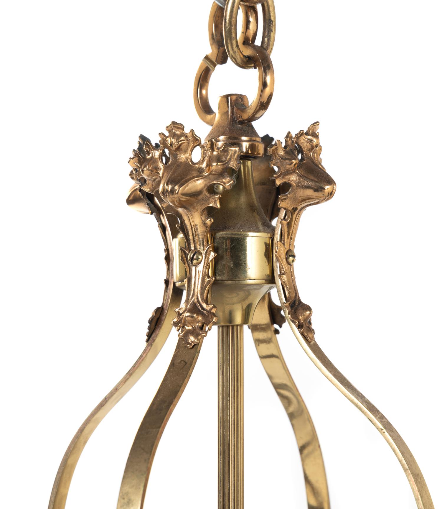 A Set of Four Gothic Style Brass Hall Lanterns