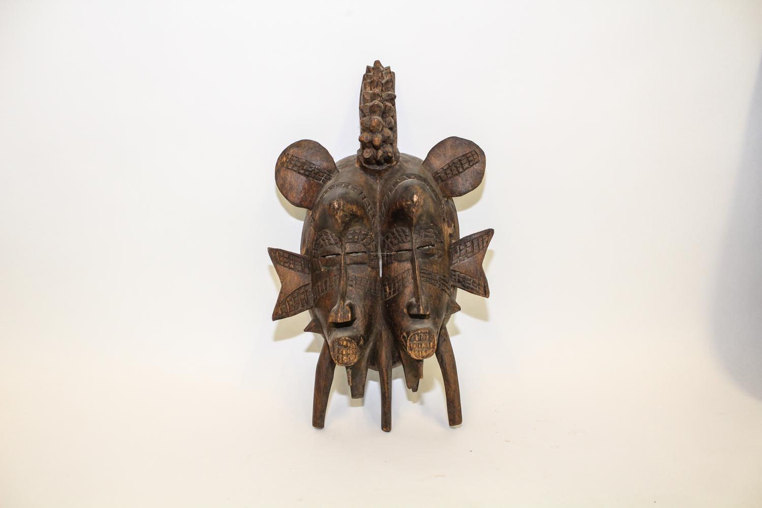 A Carved African Double Mask Height 13 1/2 inches. — MID TO LATE 20TH CENTURY