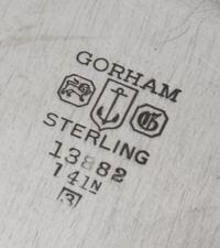 An American Silver Meat Platter, Gorham Mfg. Co., Providence, RI, 1943, of shaped circular form having a gadrooned border, the center e