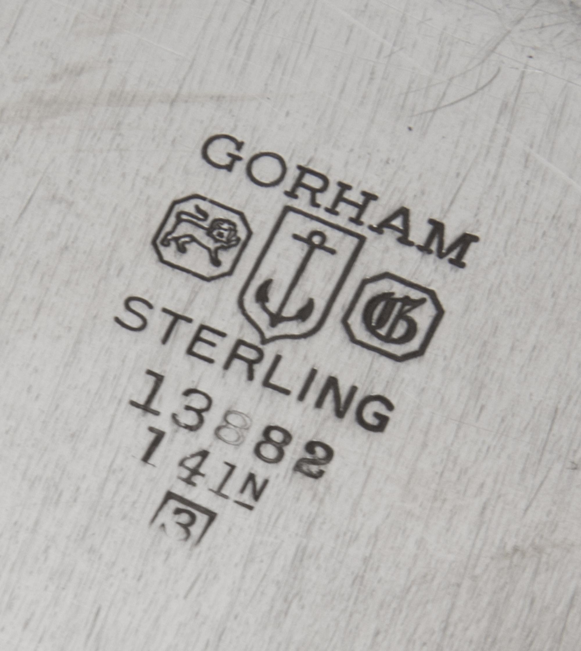 An American Silver Meat Platter, Gorham Mfg. Co., Providence, RI, 1943, of shaped circular form having a gadrooned border, the center e