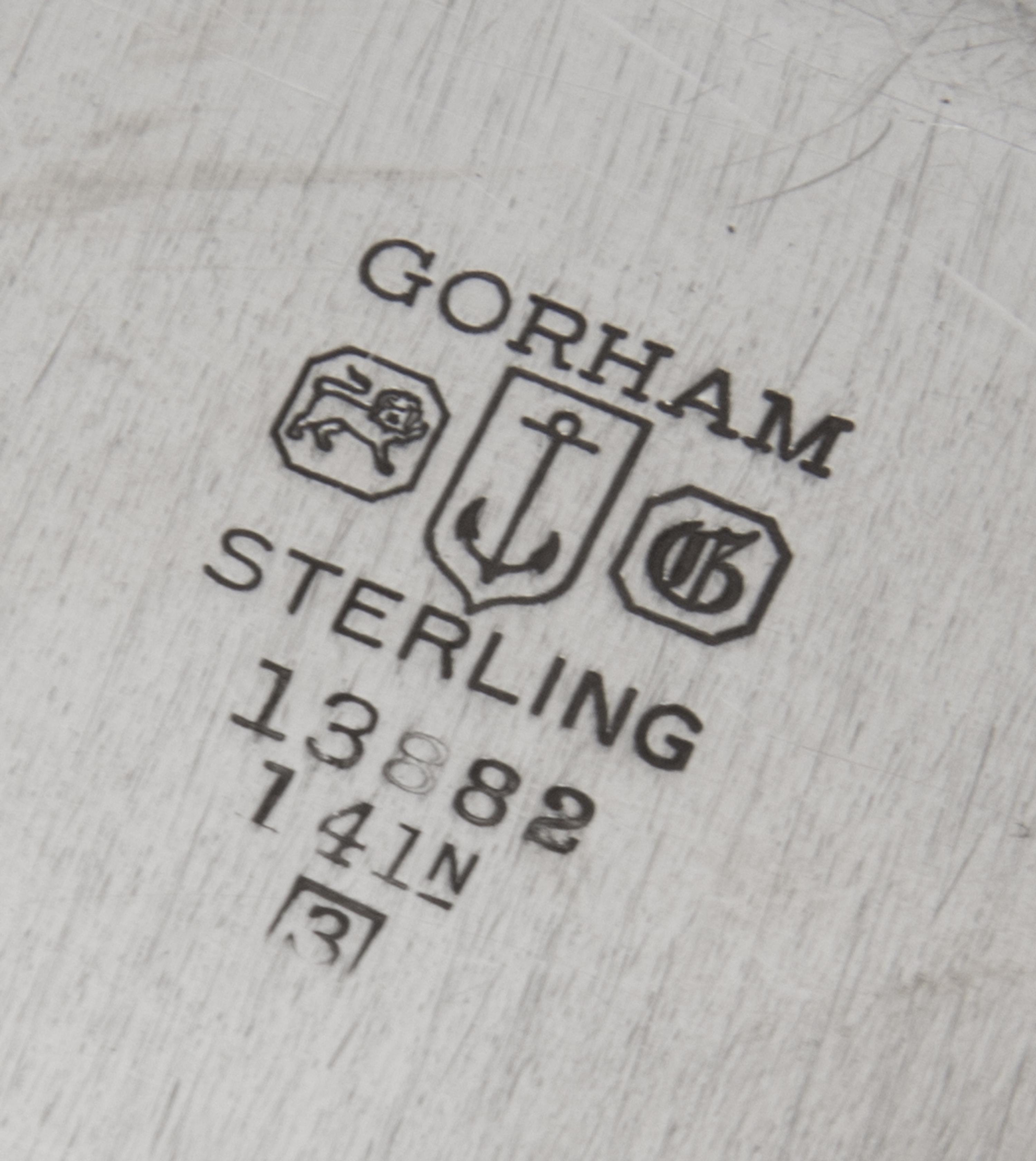 An American Silver Meat Platter, Gorham Mfg. Co., Providence, RI, 1943, of shaped circular form having a gadrooned border, the center e