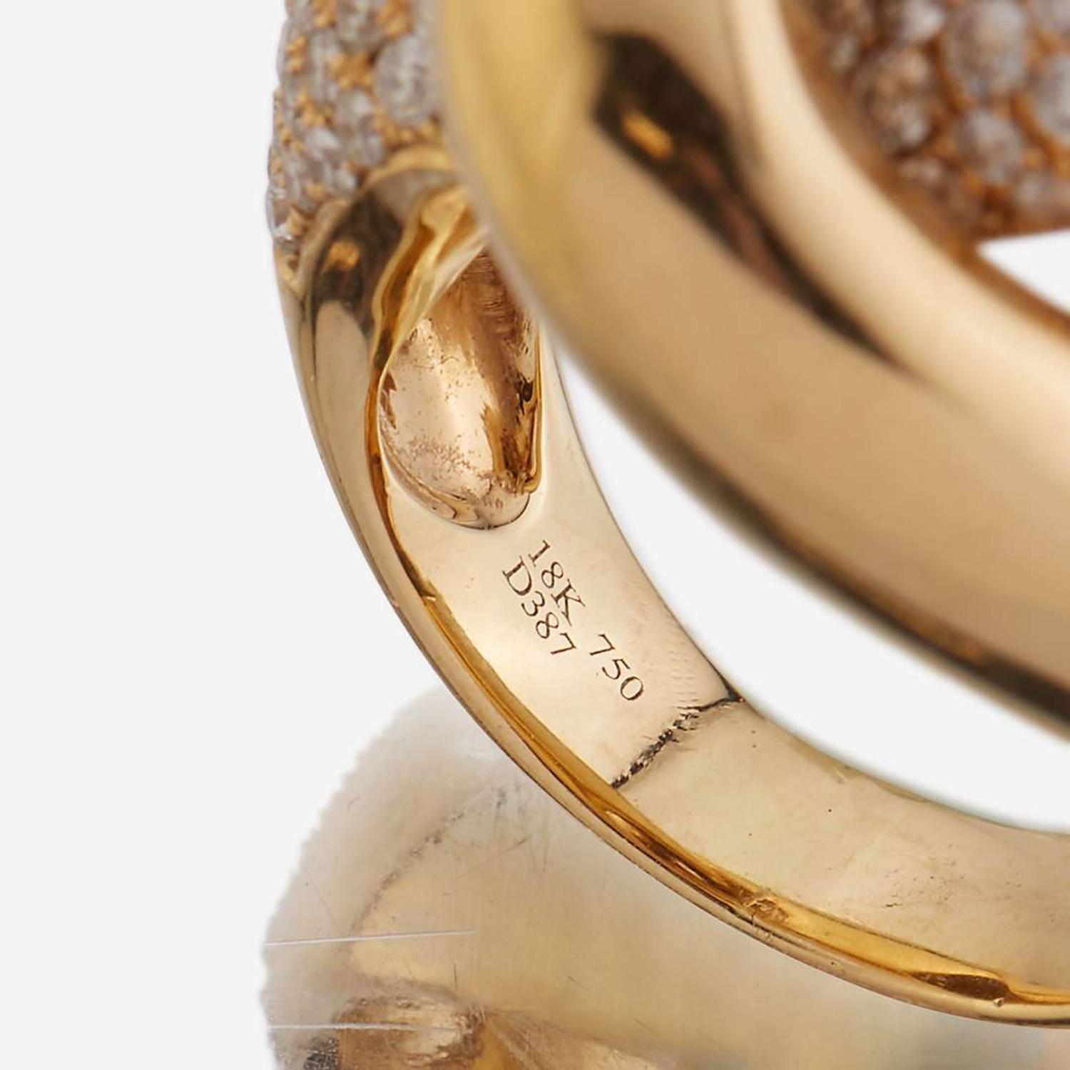 An eighteen karat gold and diamond ring