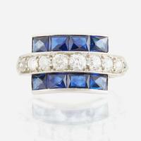 A diamond, blue glass, and platinum ring
