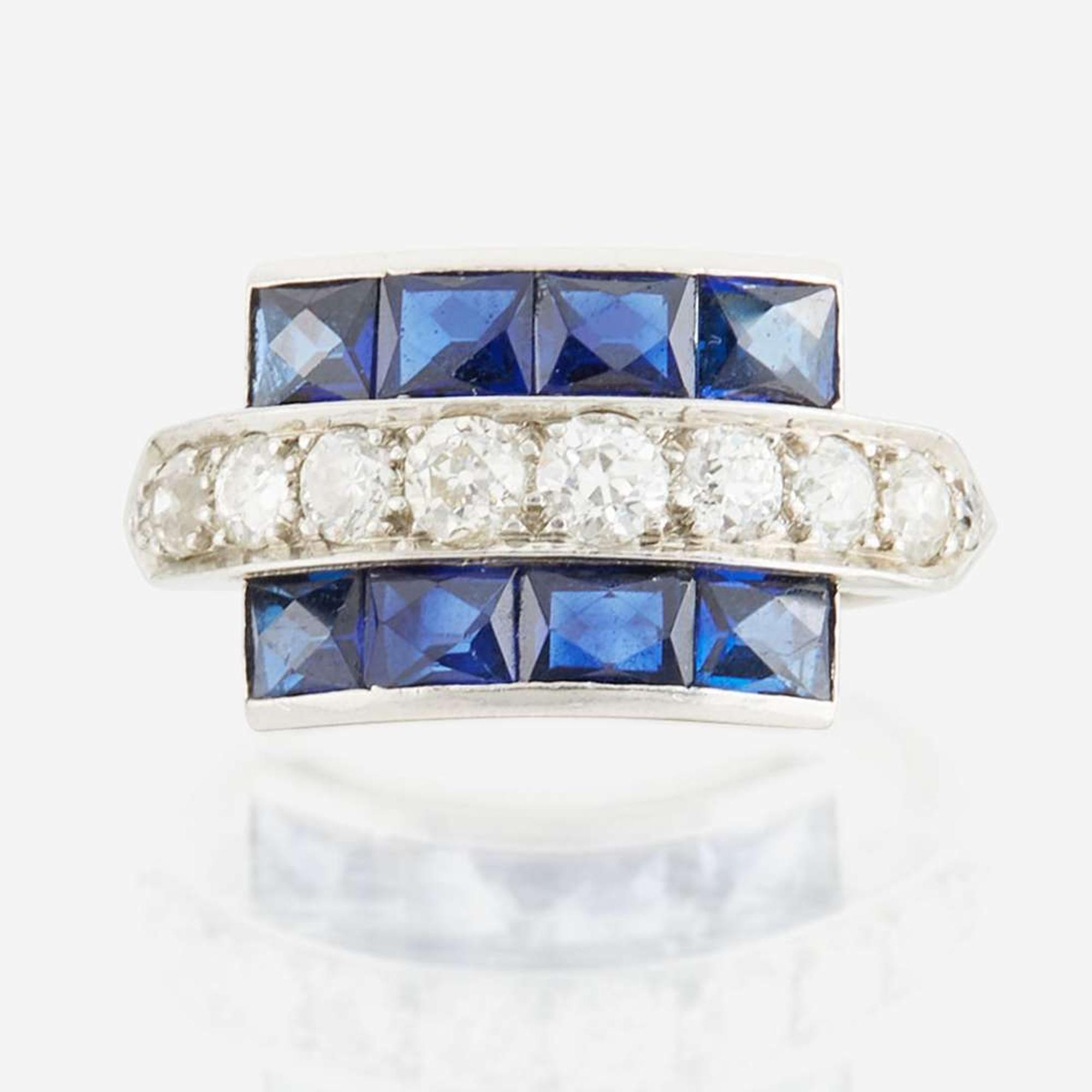 A diamond, blue glass, and platinum ring