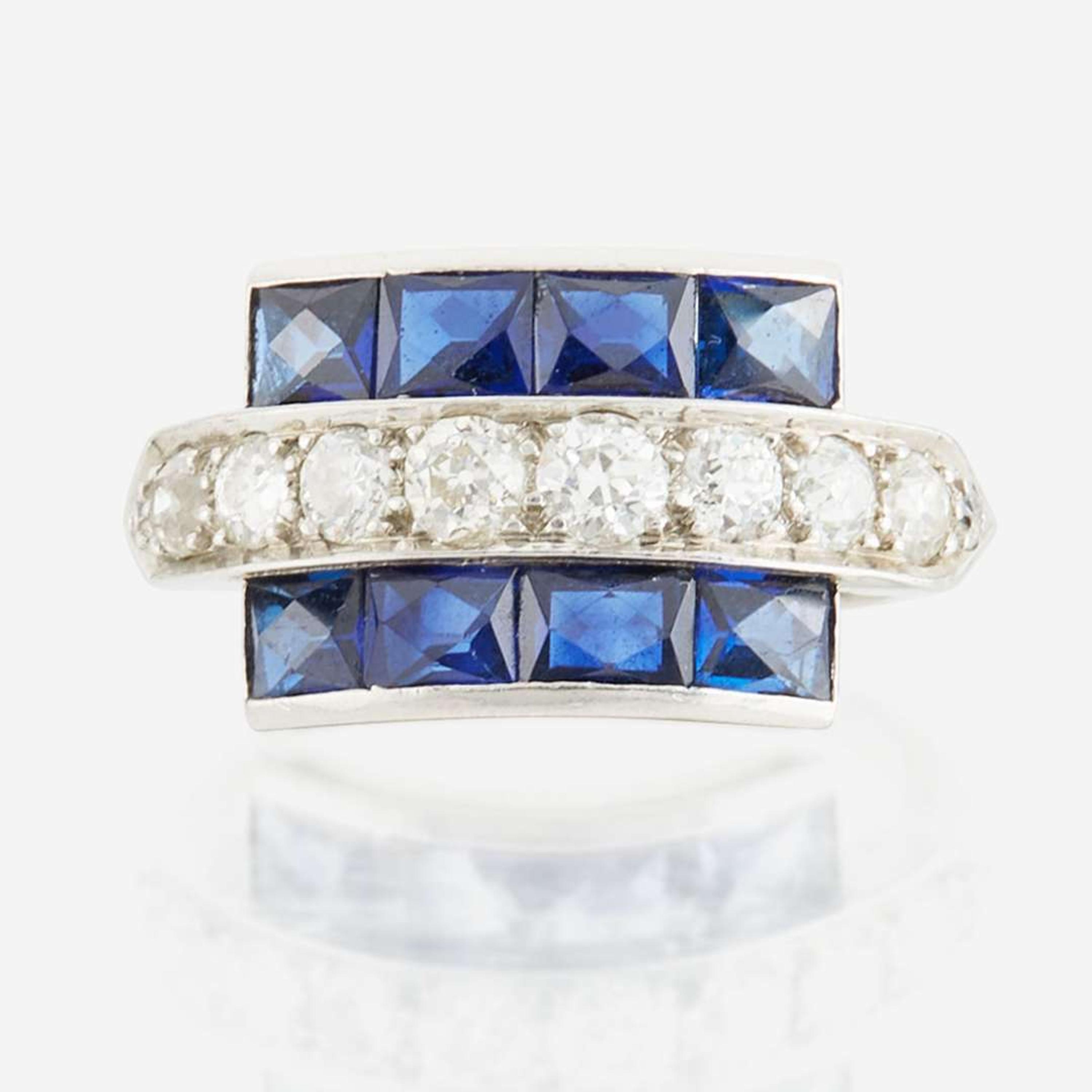 A diamond, blue glass, and platinum ring