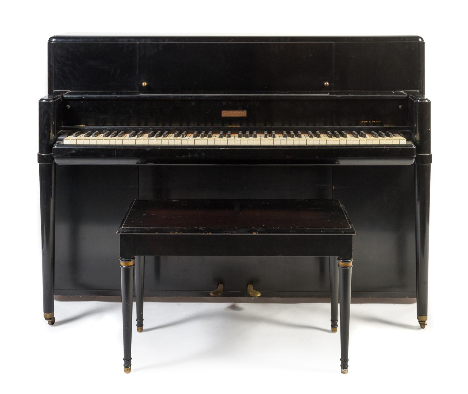 A Steinway & Sons Art Deco Style Black Lacquered Upright Piano Height 41 1/2 x width 59 x depth 23 inches.
