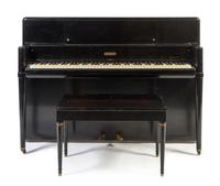 A Steinway & Sons Art Deco Style Black Lacquered Upright Piano Height 41 1/2 x width 59 x depth 23 inches.