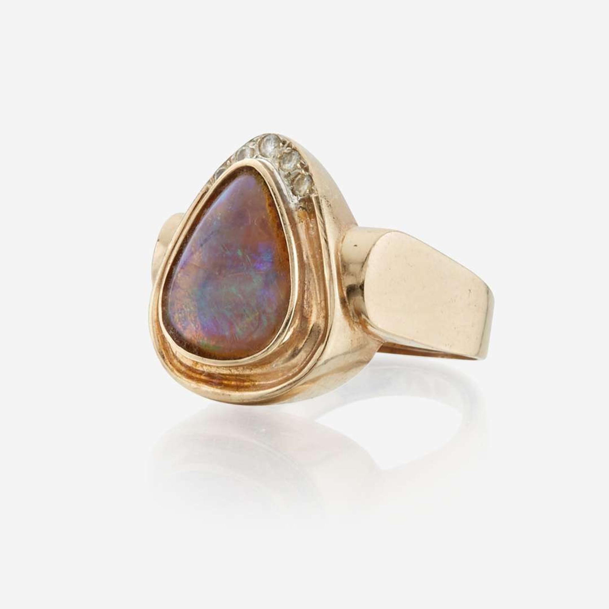 An opal, diamond, and gold ring