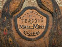 A 'Marx-Made' Clothes Peacock-Decorated Papier-Mache Advertising Sign