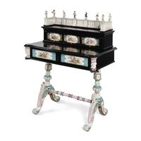 A German Ebonized and Porcelain Mounted Bureau