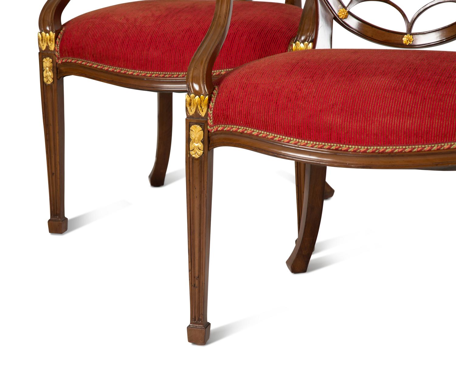 A Set of Eight George III Style Mahogany Wheel Back Armchairs.