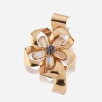 A fourteen karat gold, moonstone, and sapphire brooch