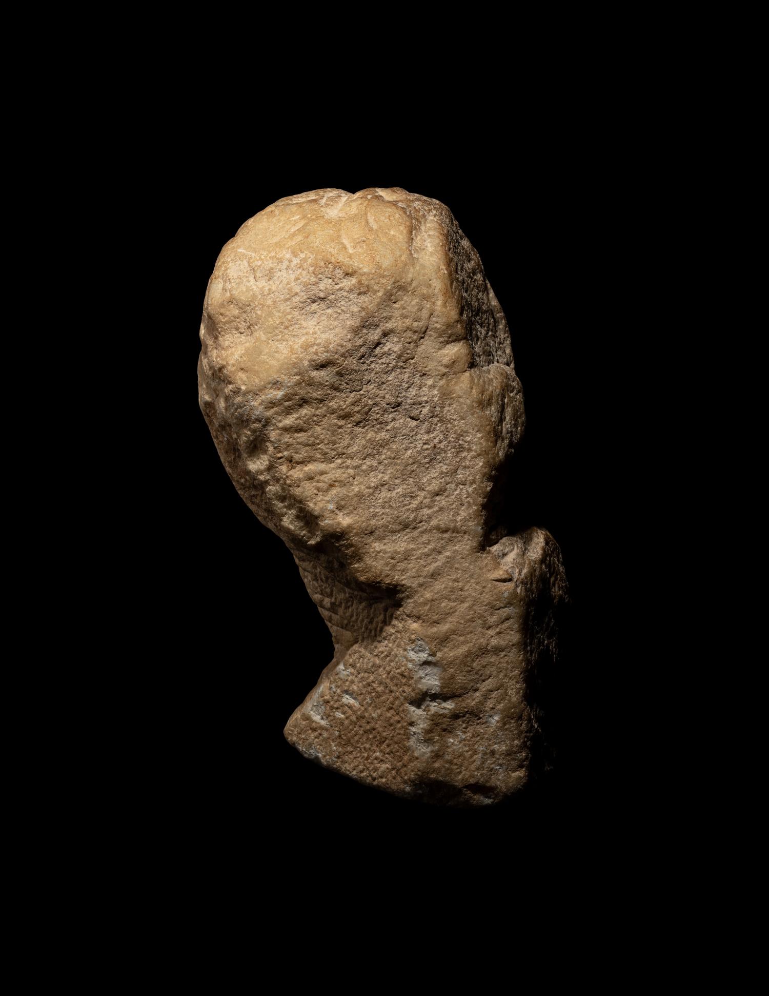 An Unfinished Greek Marble Head of a Woman