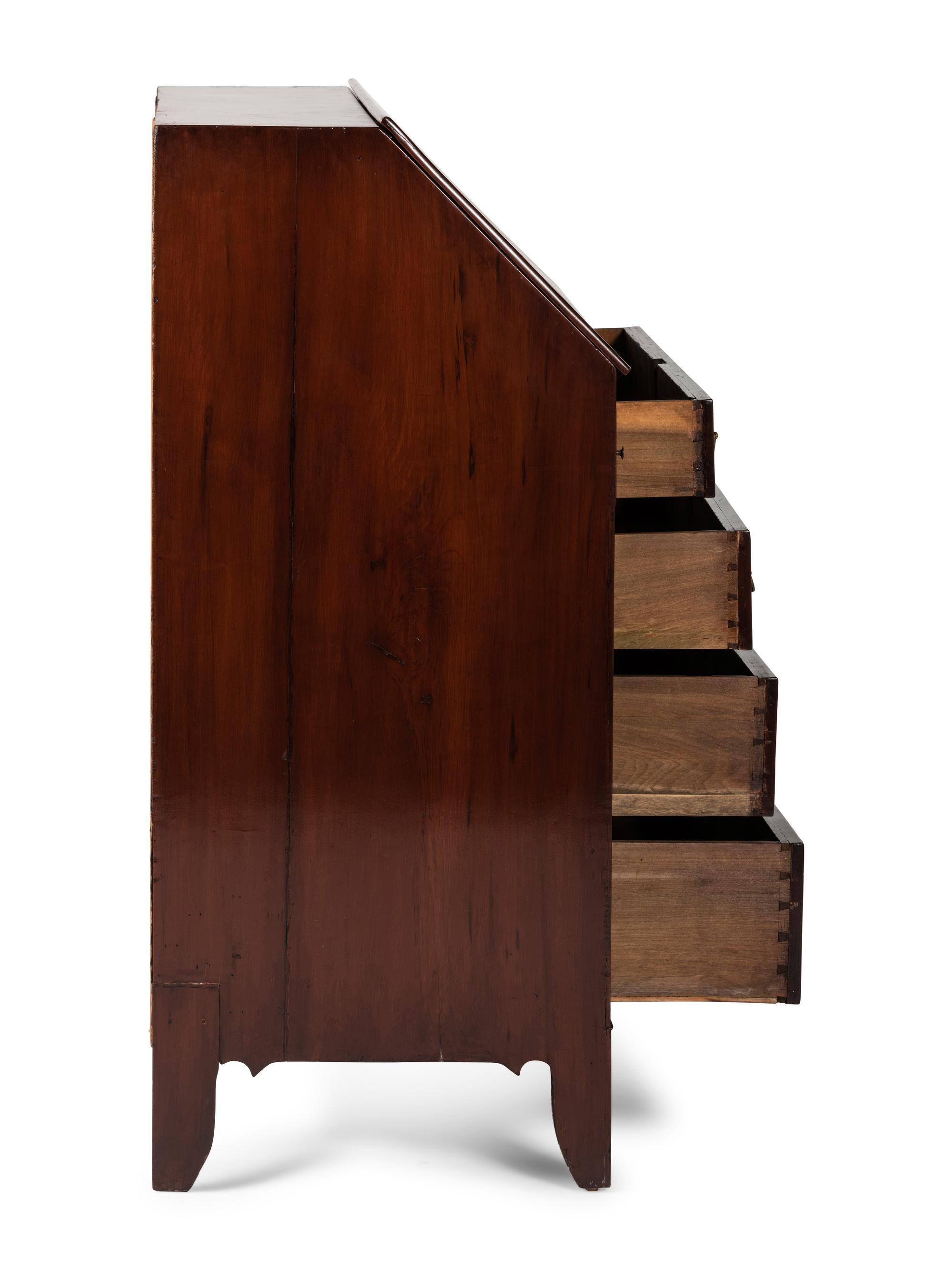 A Chippendale Cherrywood Slant-Front Chest of Drawers