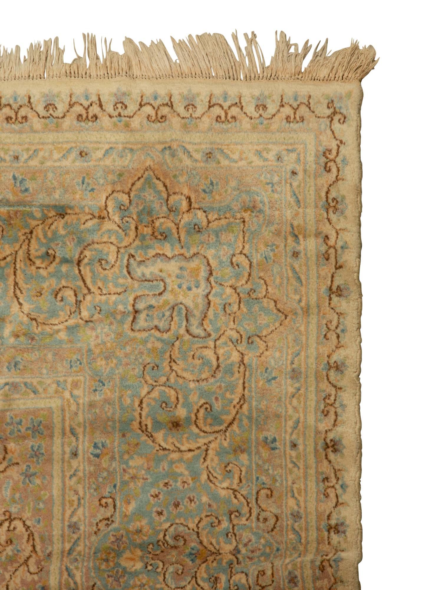 A Kirman Wool Rug — 20th Century