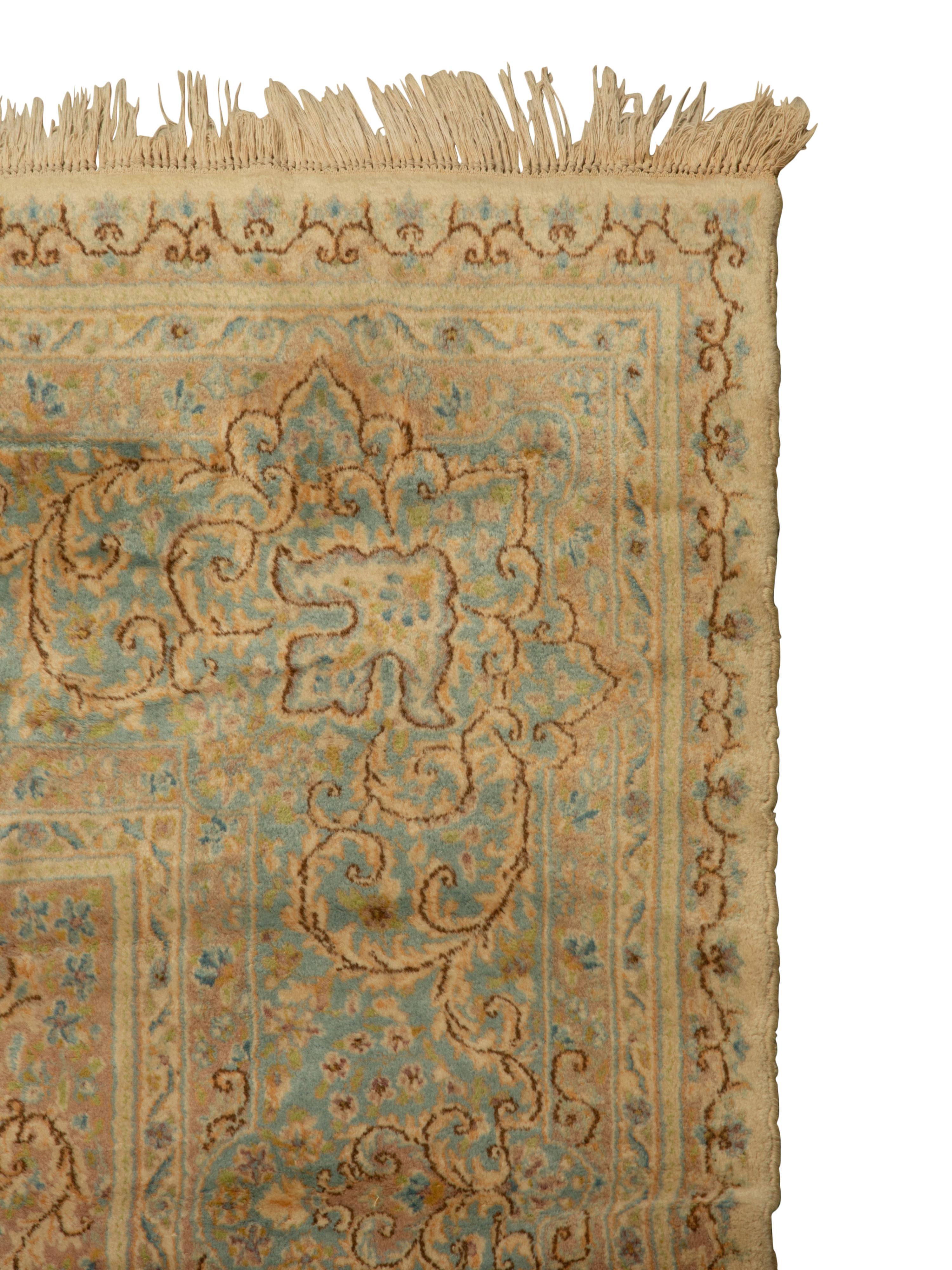 A Kirman Wool Rug — 20th Century