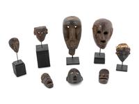 A Group of Eight Miniature Ethnographic Carved Masks