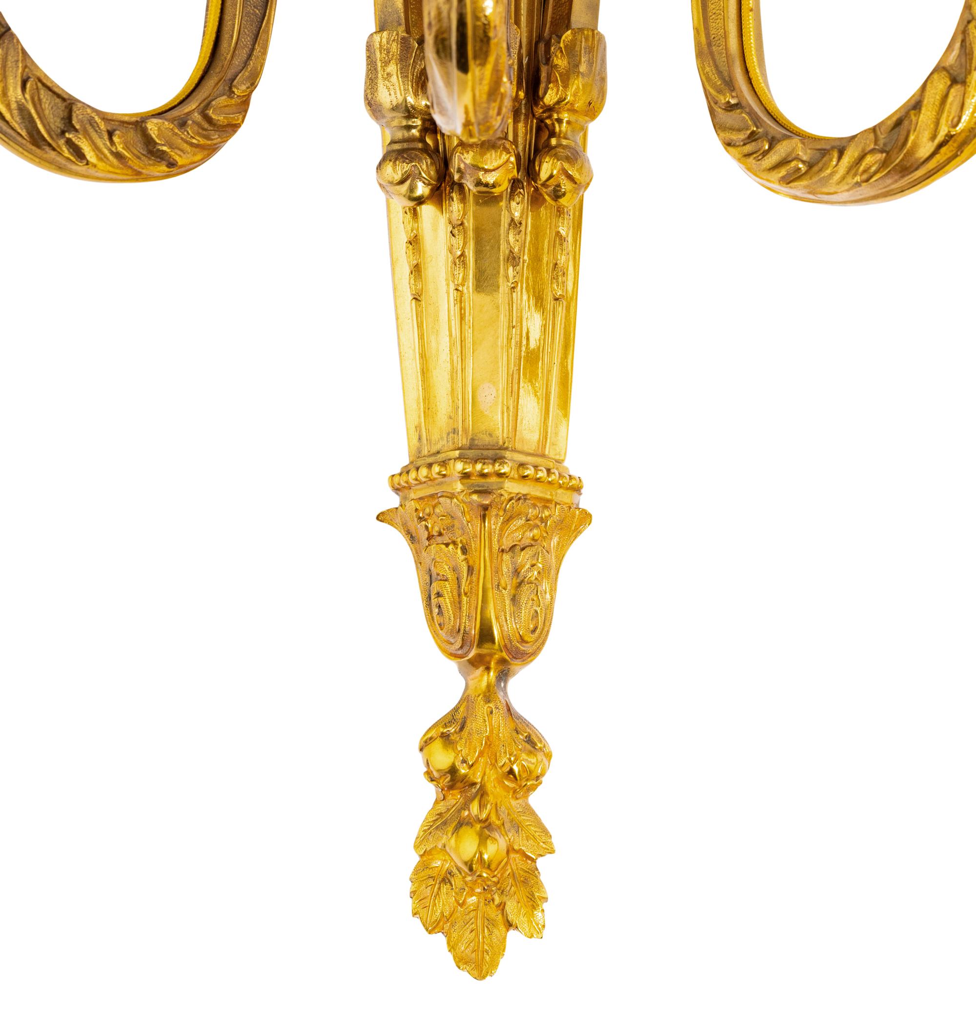 A Pair of Louis XVI Gilt Bronze Three-Light Sconces