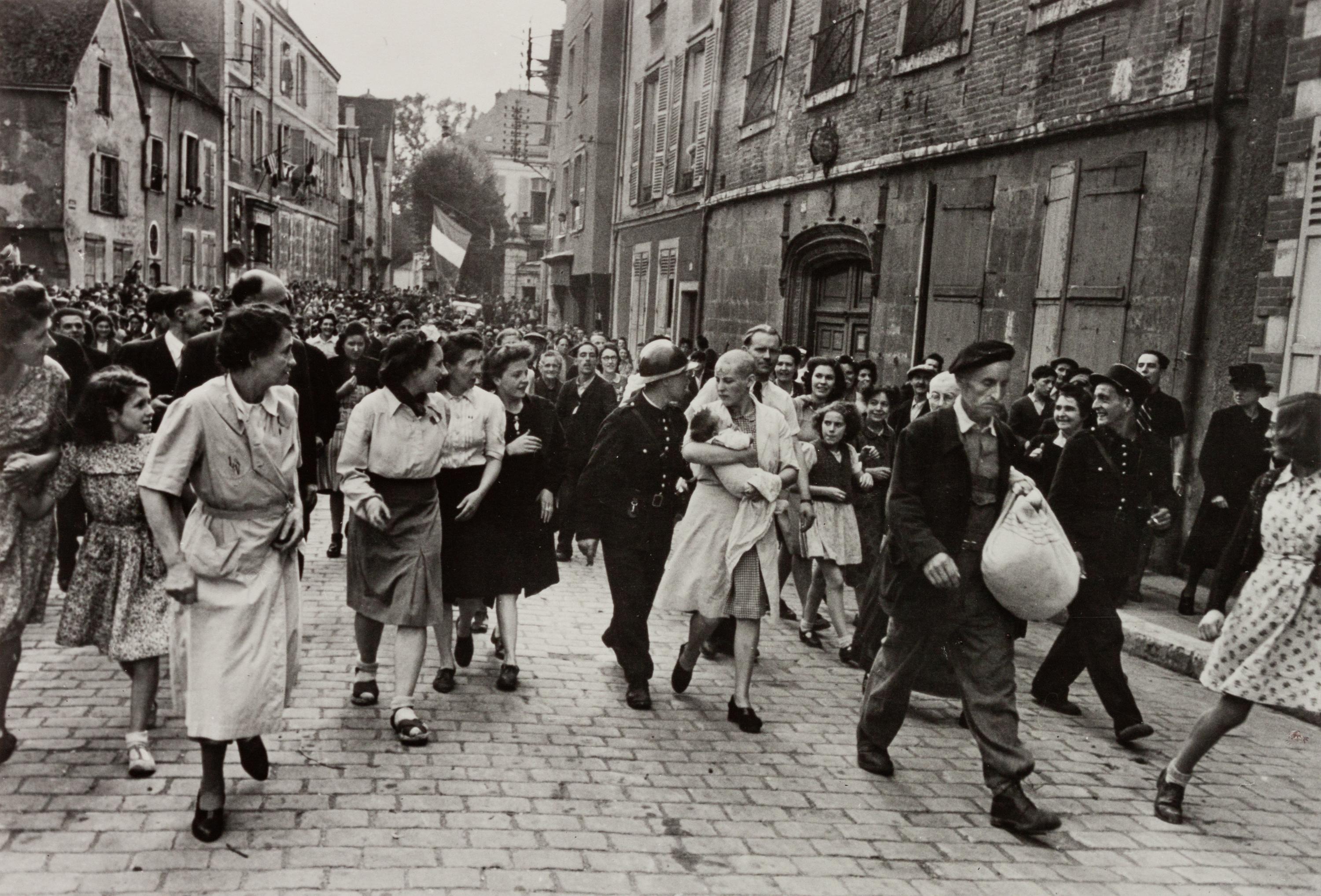 A pair of photographs ( China , 1930s; Chartres , August 18, 1944)