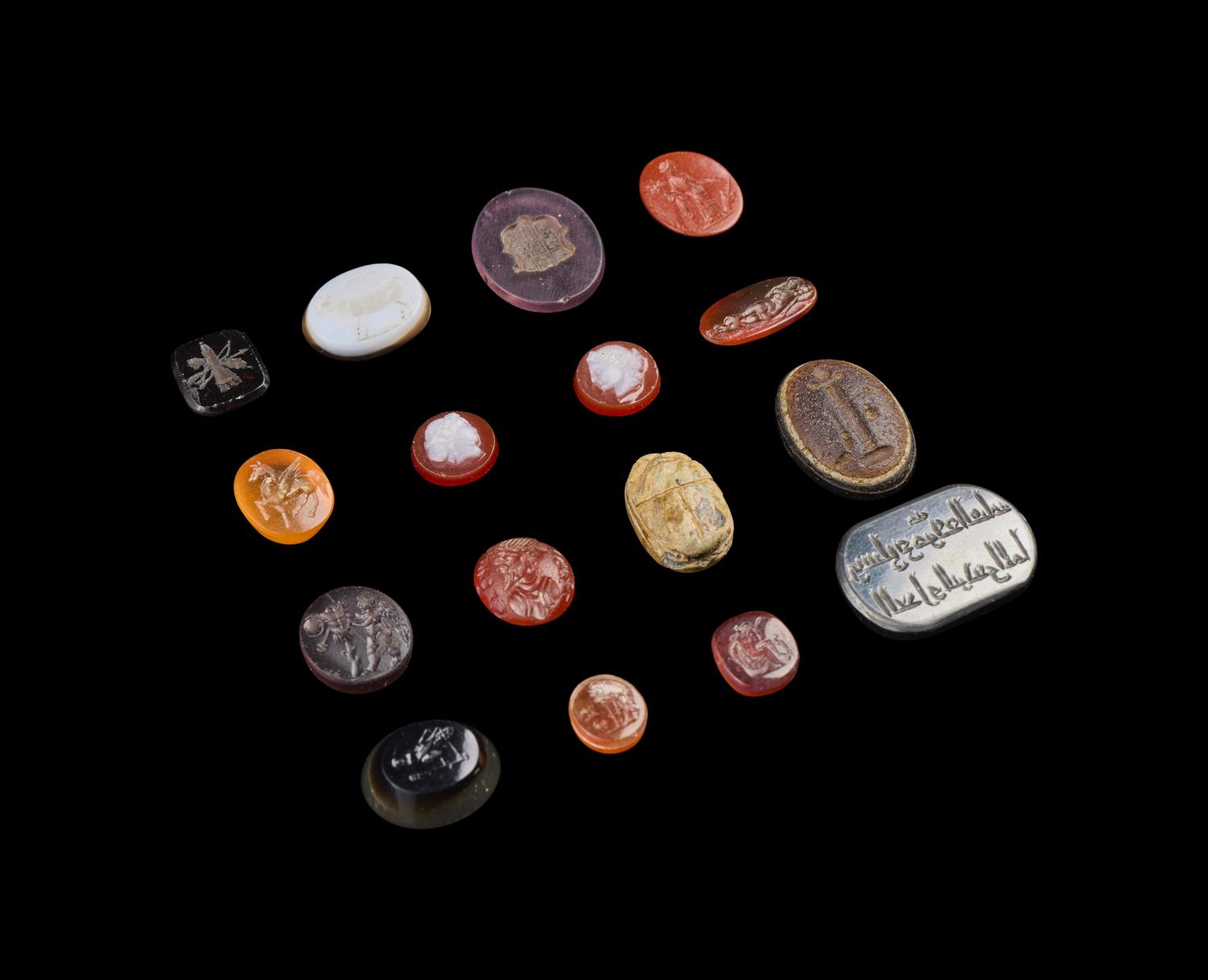 A Group of Sixteen Roman and Neoclassical Stone and Glass Intaglios