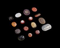 A Group of Sixteen Roman and Neoclassical Stone and Glass Intaglios