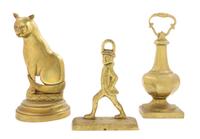 Three Brass Doorstops Height of tallest 11 1/2 inches.