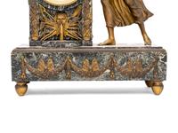 An Empire Style Gilt Metal and Marble Figural Mantel Clock