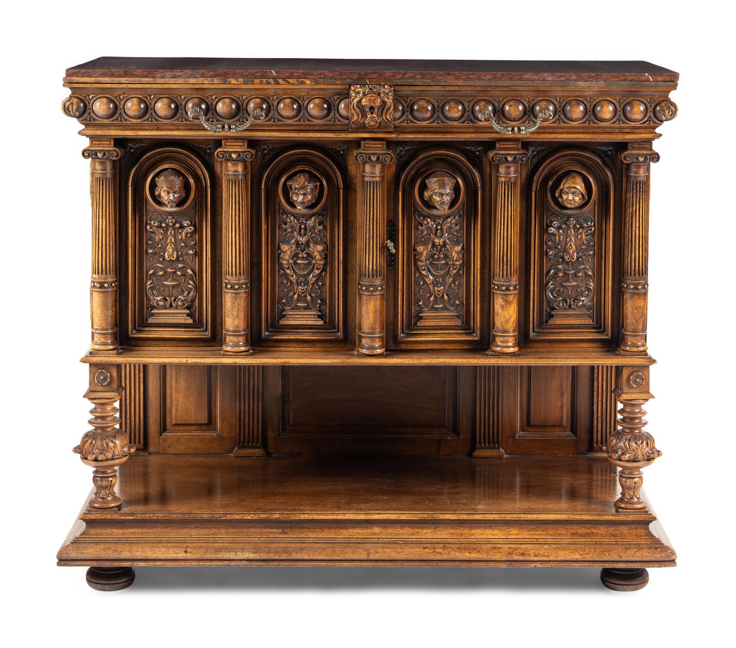A Renaissance Revival Carved Walnut Marble-Top Cabinet