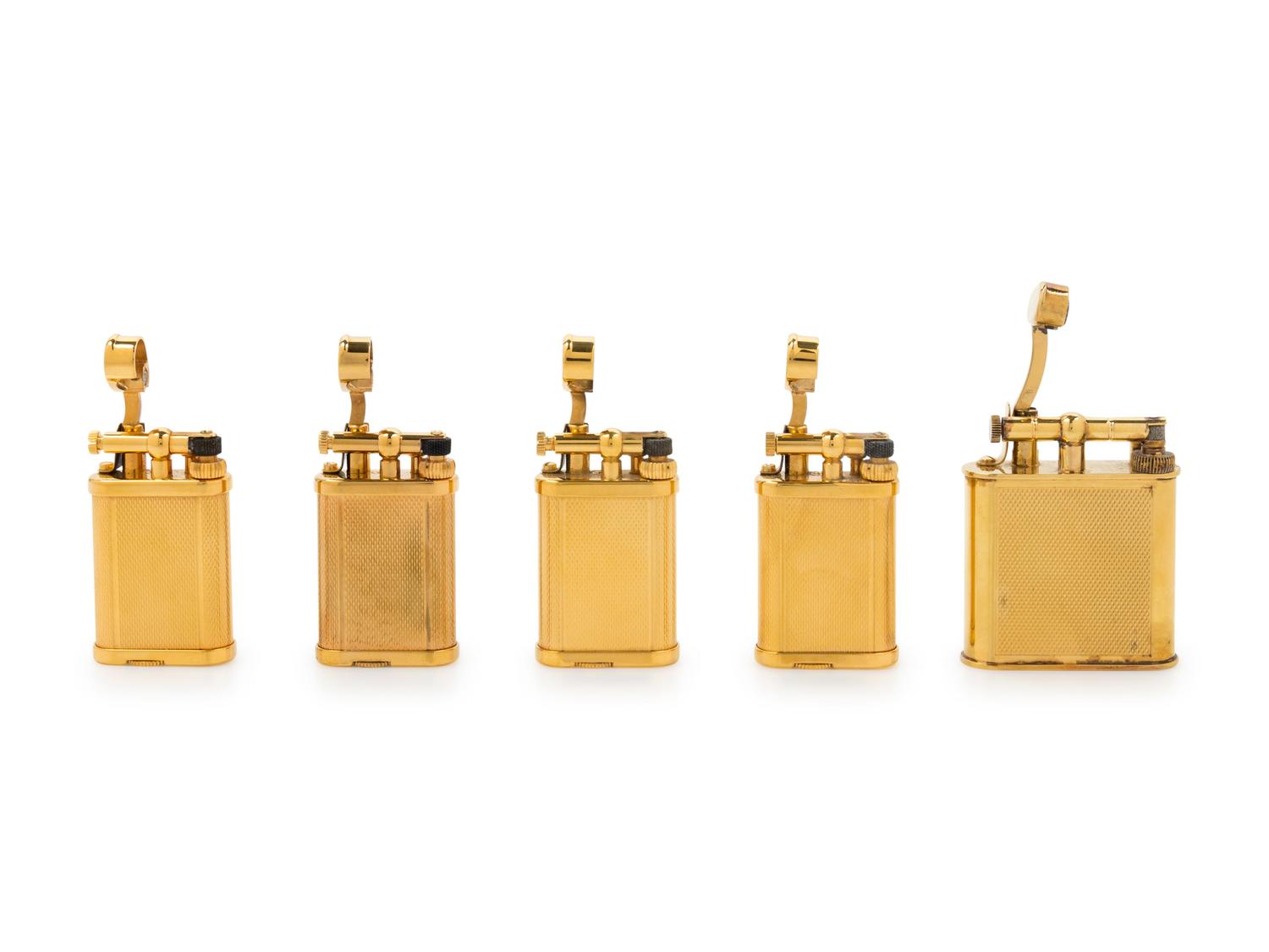A Group of Five Gilt Metal Dunhill Lift-Arm Lighters