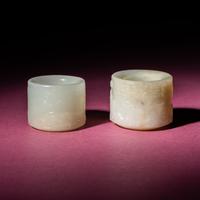 Two Chinese White Jade Carved and Inscribed Archer's Rings, 18th/19th Century — 清中期 白玉扳指兩枚