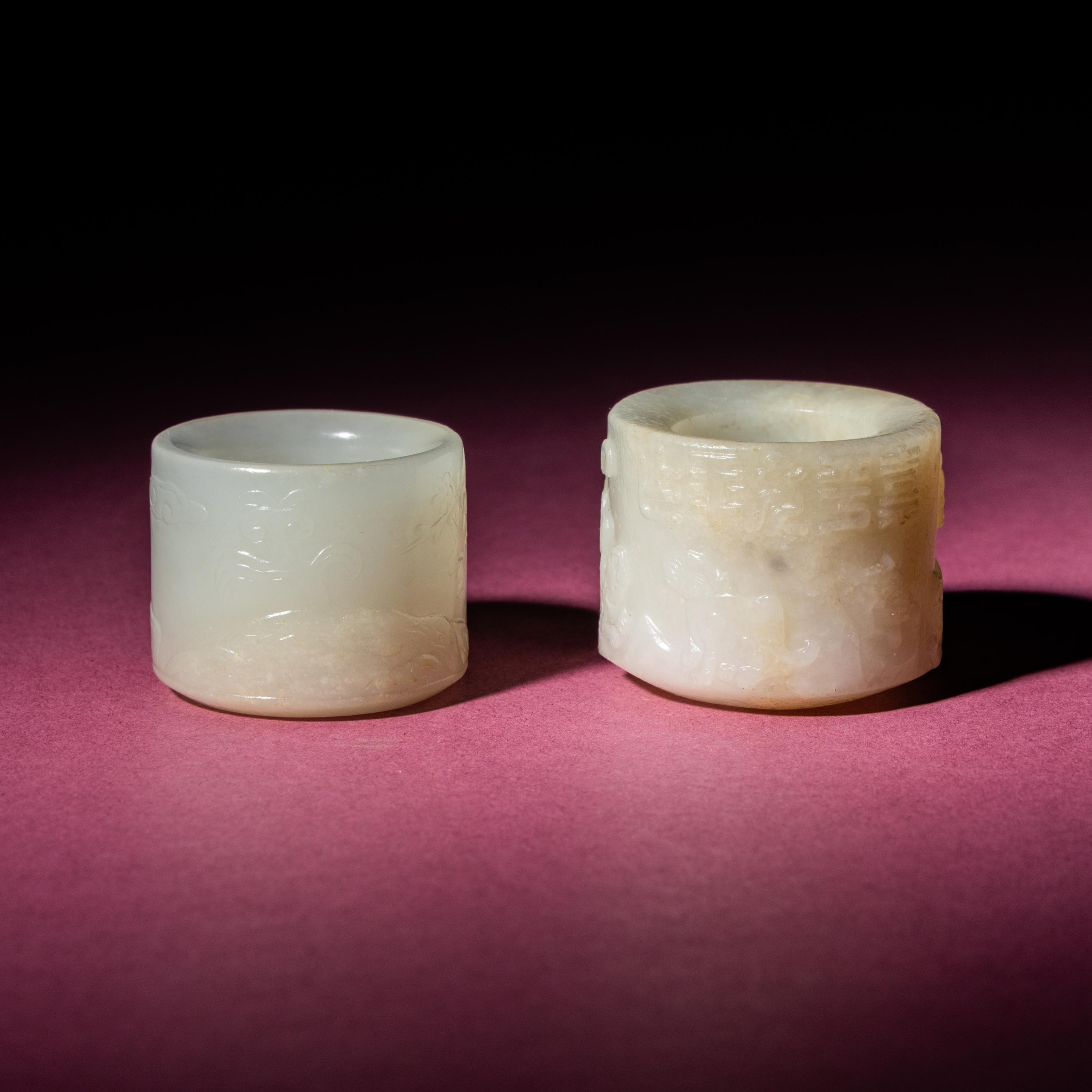 Two Chinese White Jade Carved and Inscribed Archer's Rings, 18th/19th Century — 清中期 白玉扳指兩枚