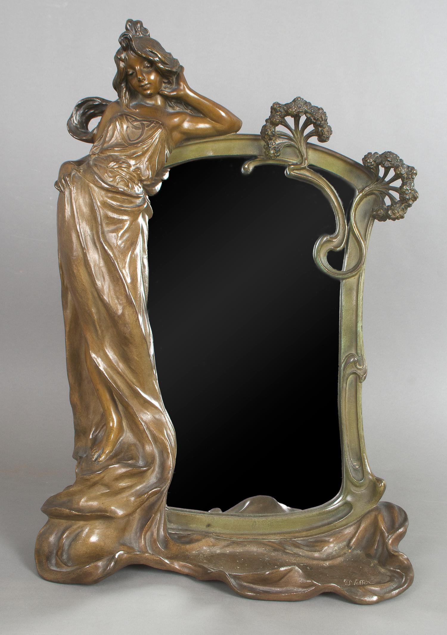 An Art Nouveau Patinated Metal Mirror, Robert Pfeffer, Height 20 3/4 x width 14 1/4 x depth 6 1/4 inches.