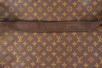 A Louis Vuitton Leather Garment Bag — 20TH CENTURY