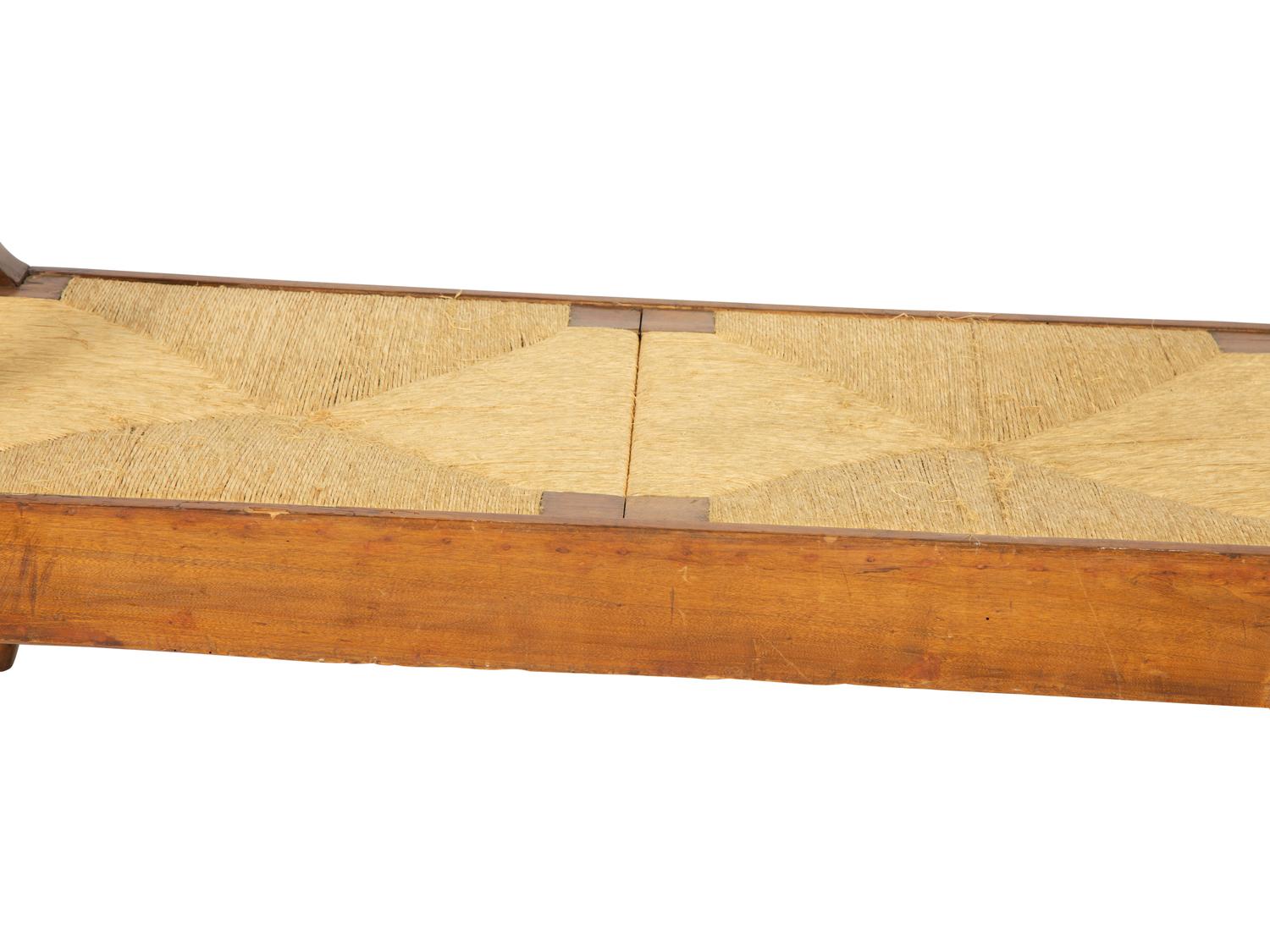 A Northern European Carved Walnut Bench with Rush Seat
