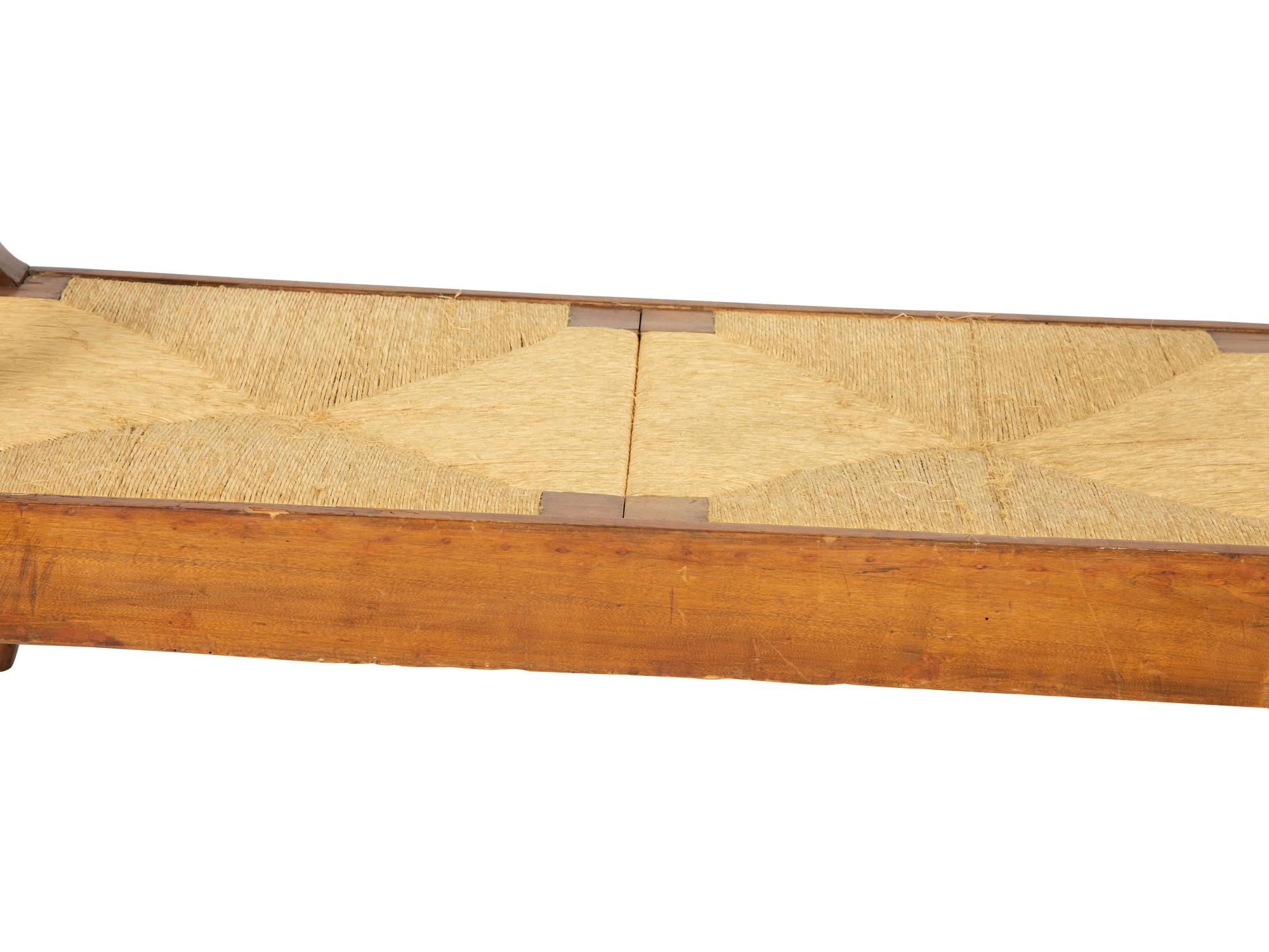 A Northern European Carved Walnut Bench with Rush Seat