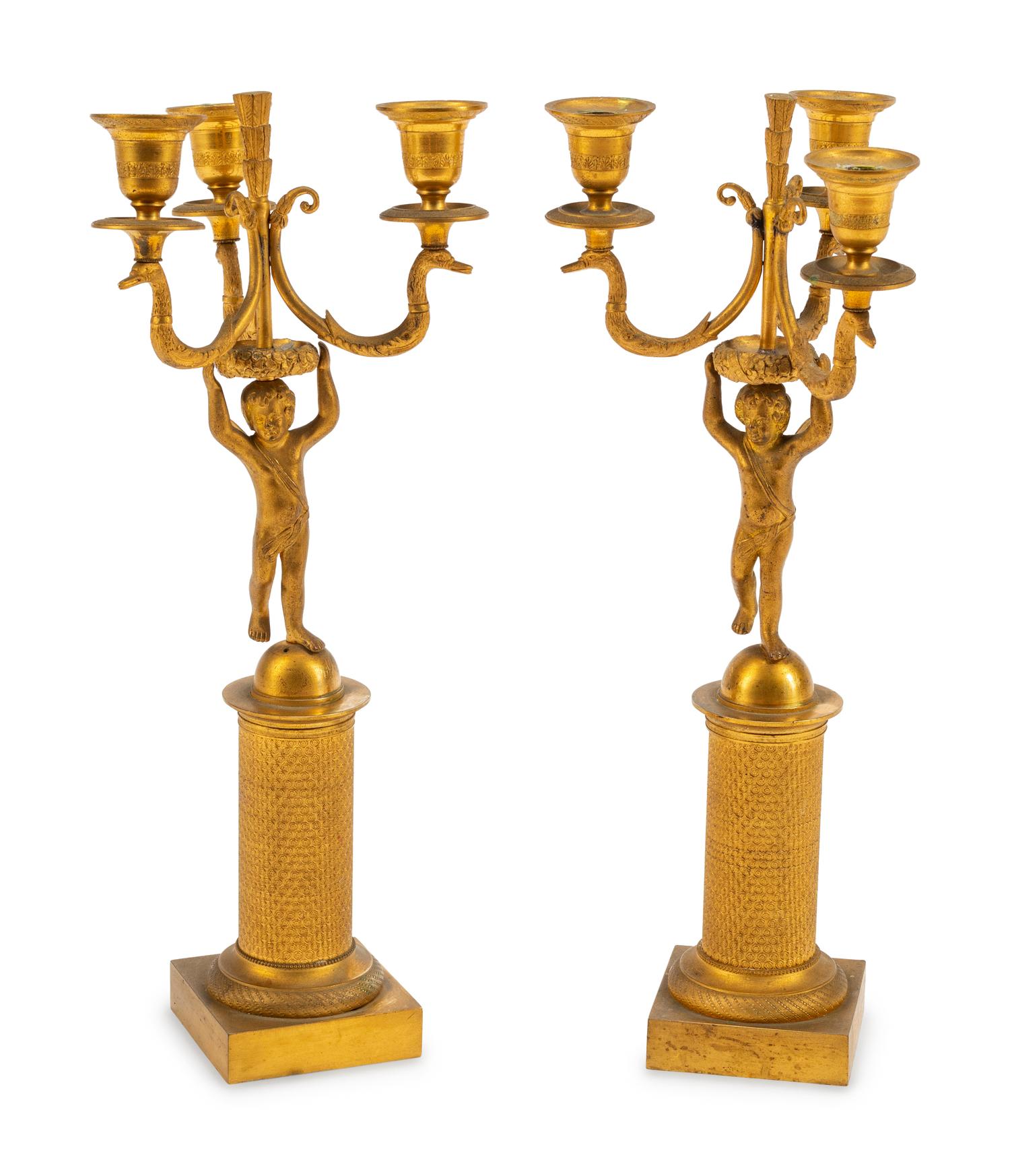 A Pair of Empire Style Gilt Bronze Figural Three-Light Candelabra