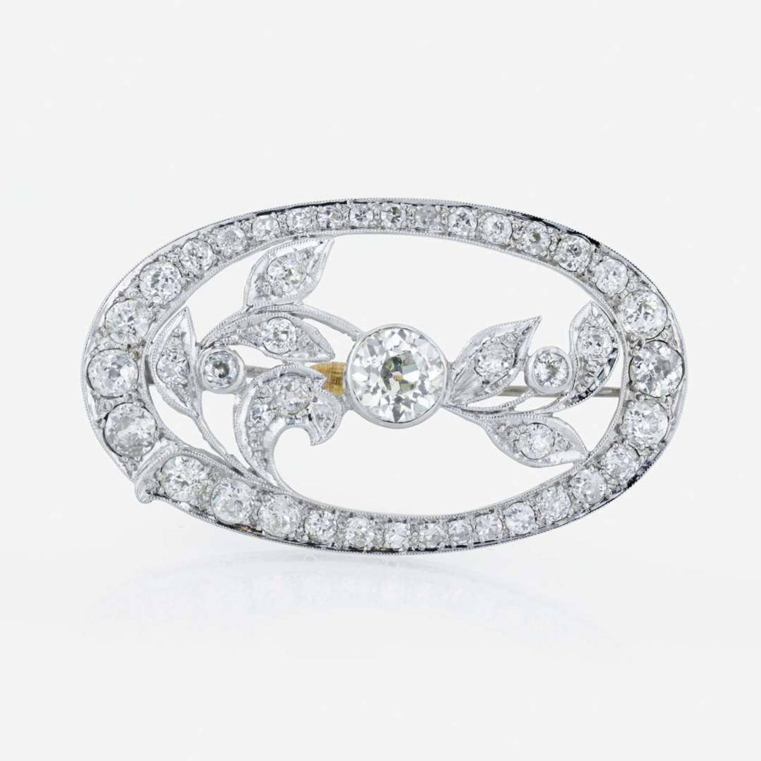 An Edwardian platinum and diamond brooch pendant