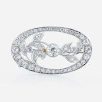 An Edwardian platinum and diamond brooch pendant