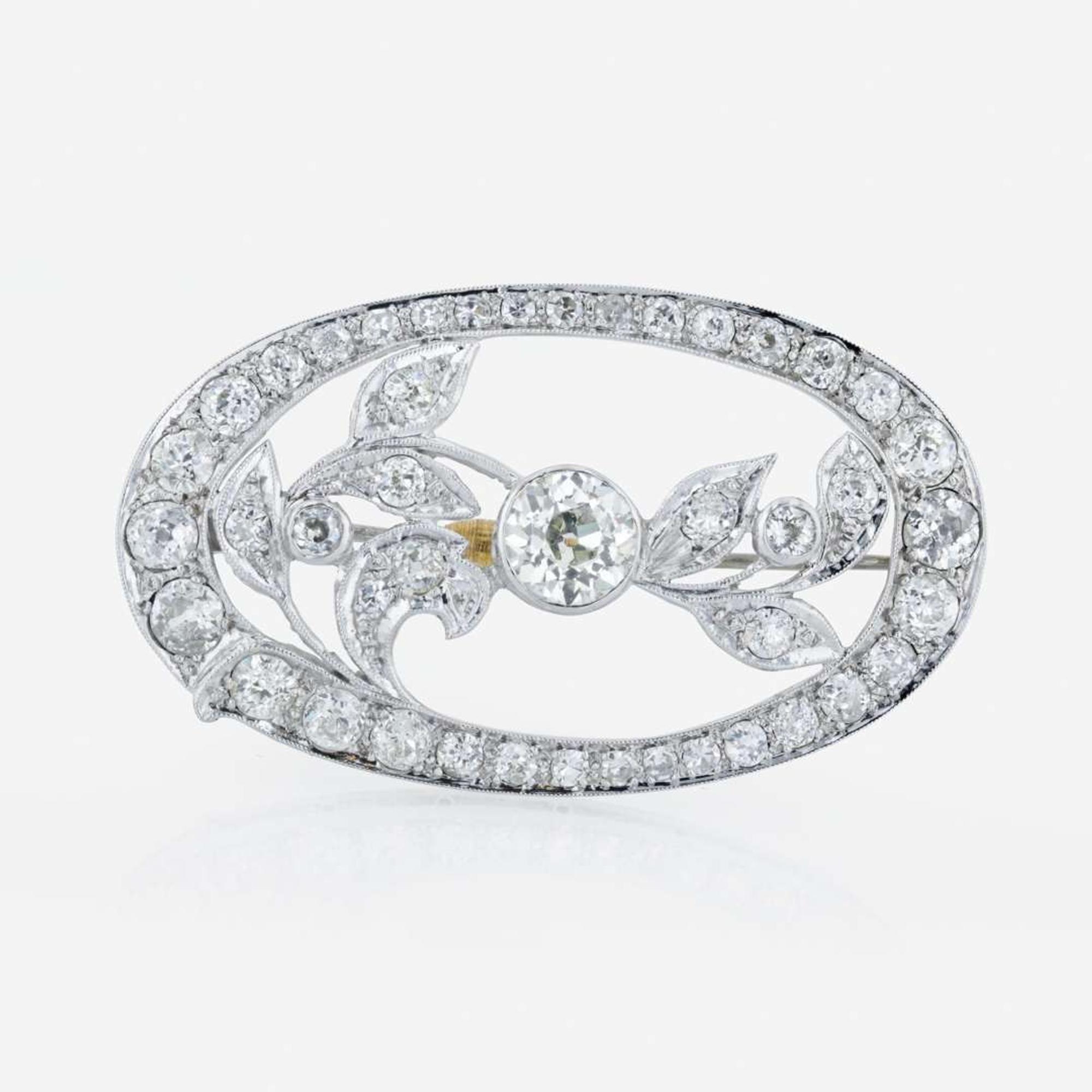 An Edwardian platinum and diamond brooch pendant