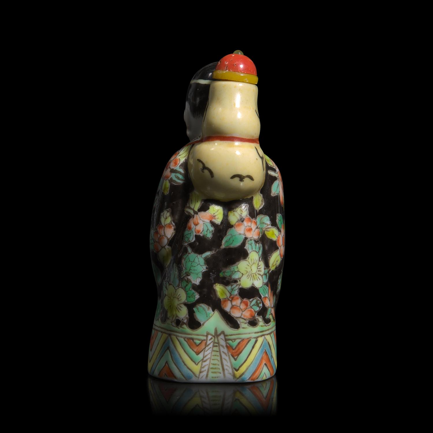 A Chinese Enameled Molded Porcelain Figural Snuff Bottle, Late 19th century
