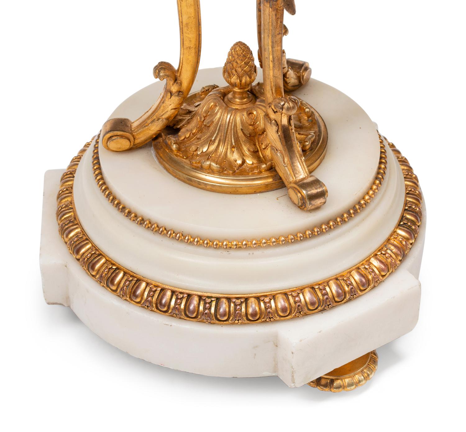 A Pair of Louis XVI Style Gilt Bronze and Marble Seven-Light Candelabra