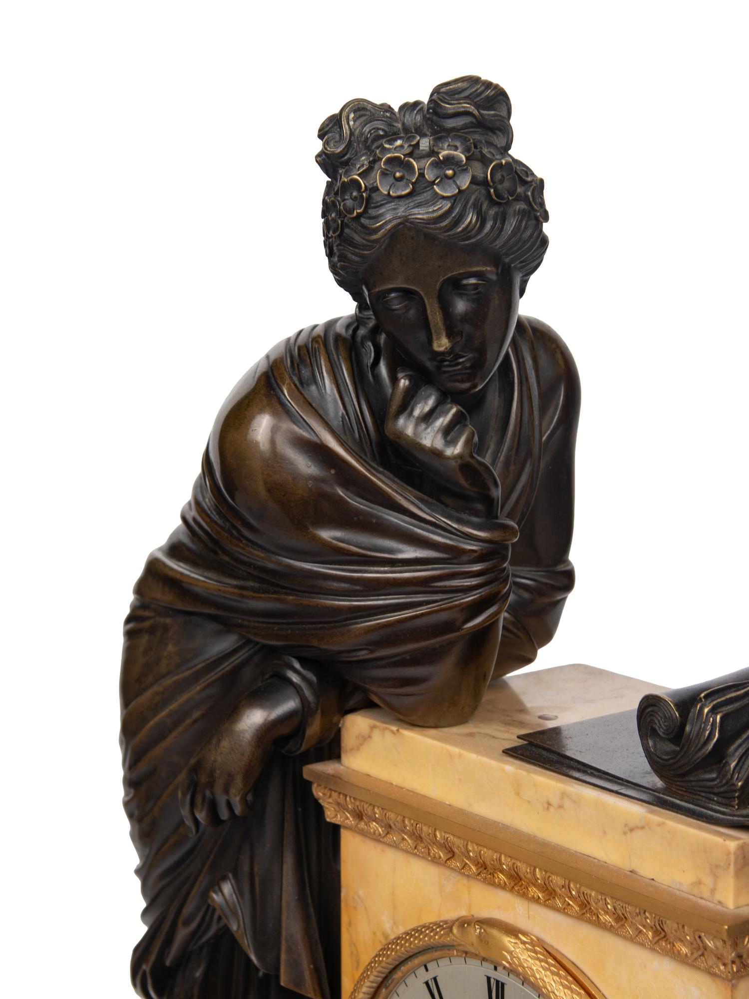 A Large Empire Gilt and Patinated Bronze and Marble Figural Clock