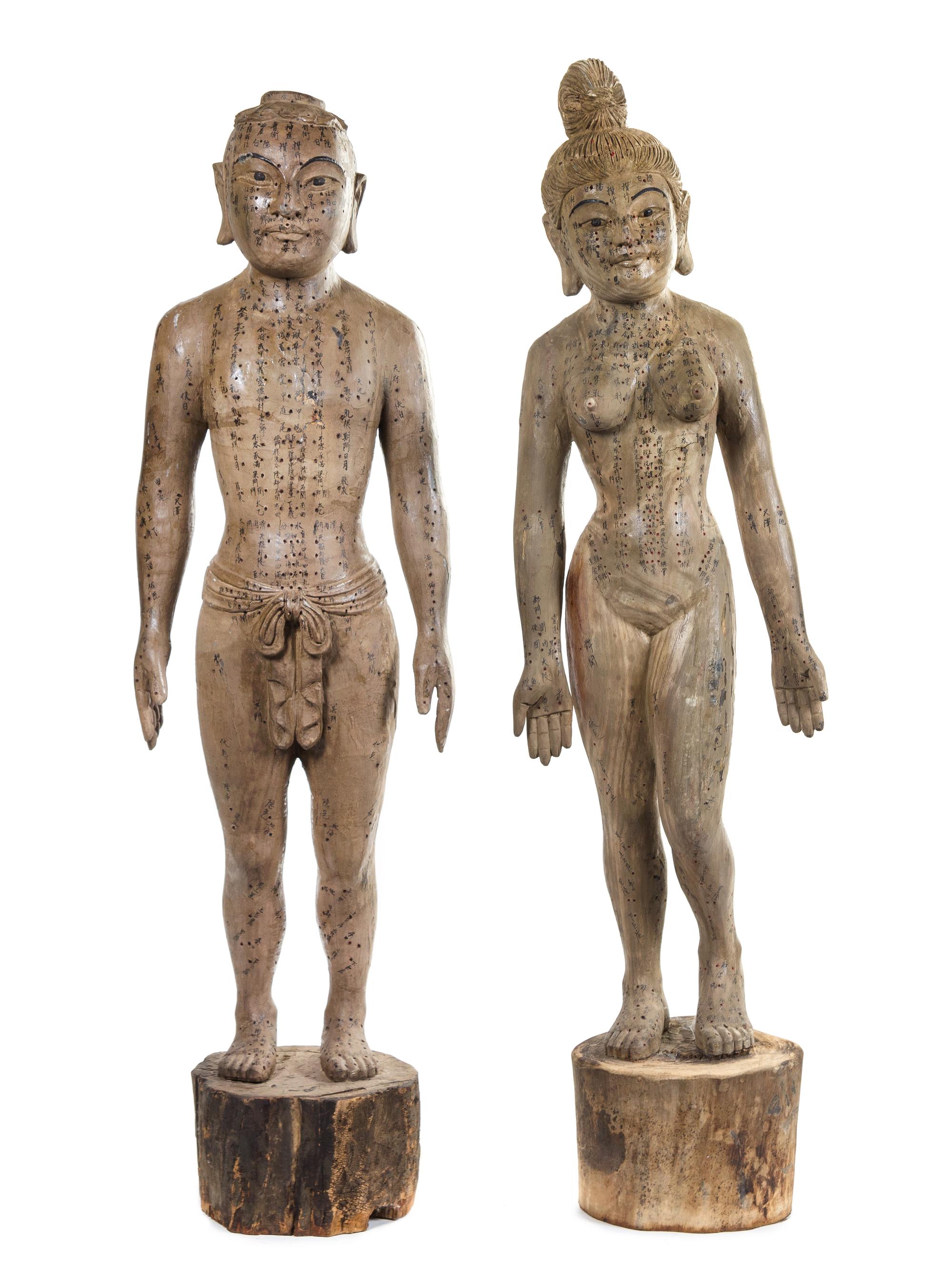 A Pair of Chinese Carved Wood Acupuncture Models Height of tallest 59 inches. — 19TH CENTURY