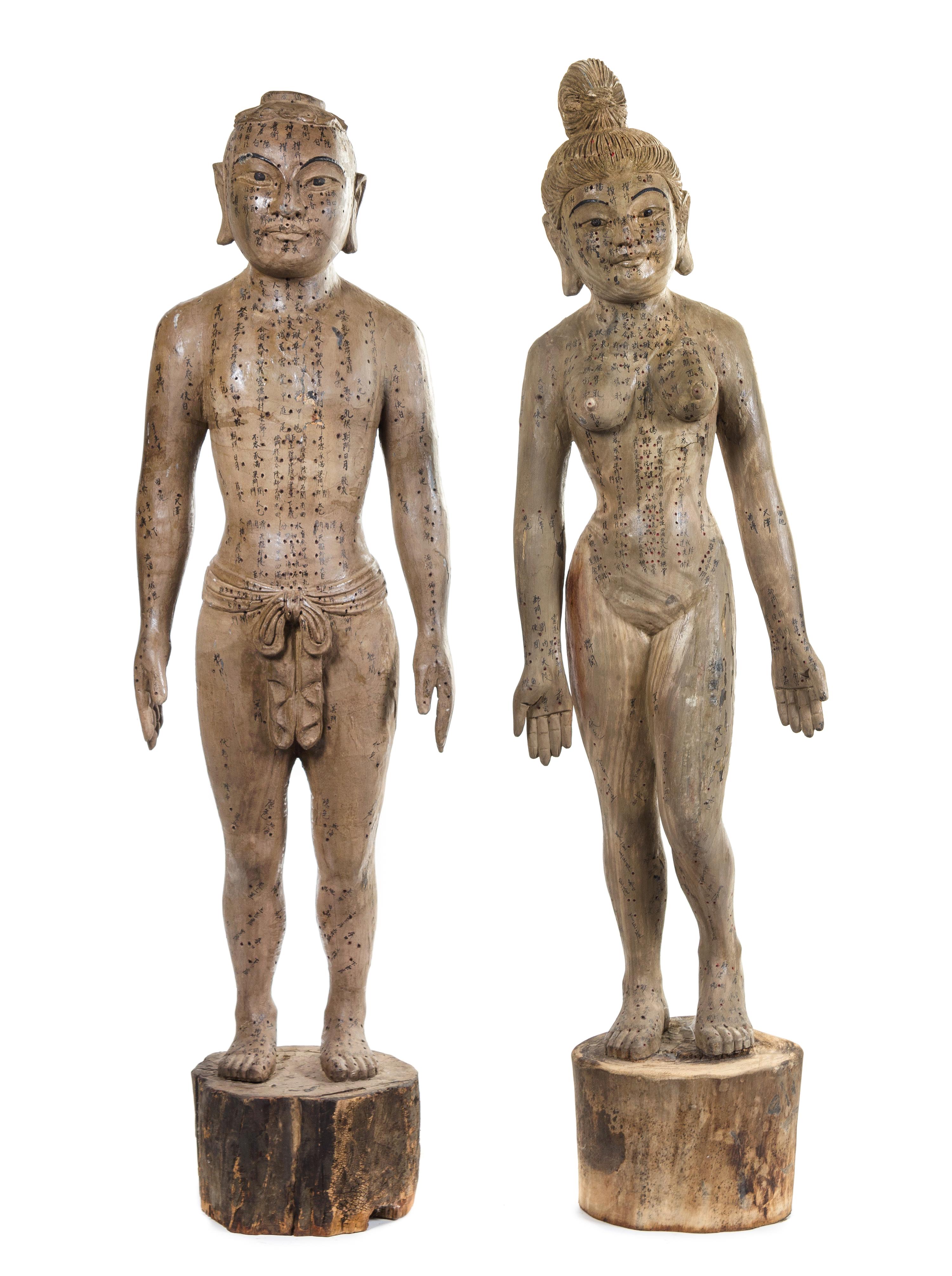 A Pair of Chinese Carved Wood Acupuncture Models Height of tallest 59 inches. — 19TH CENTURY