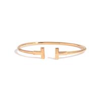 TIFFANY & CO., YELLOW GOLD BANGLE BRACELET